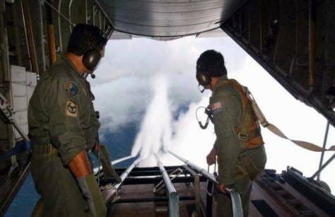 Malaysian Air Force personnel cloud seeding with chemical trails (chemtrails) in an effort to combat forest fires in 2005.  IMAGE SOURCE