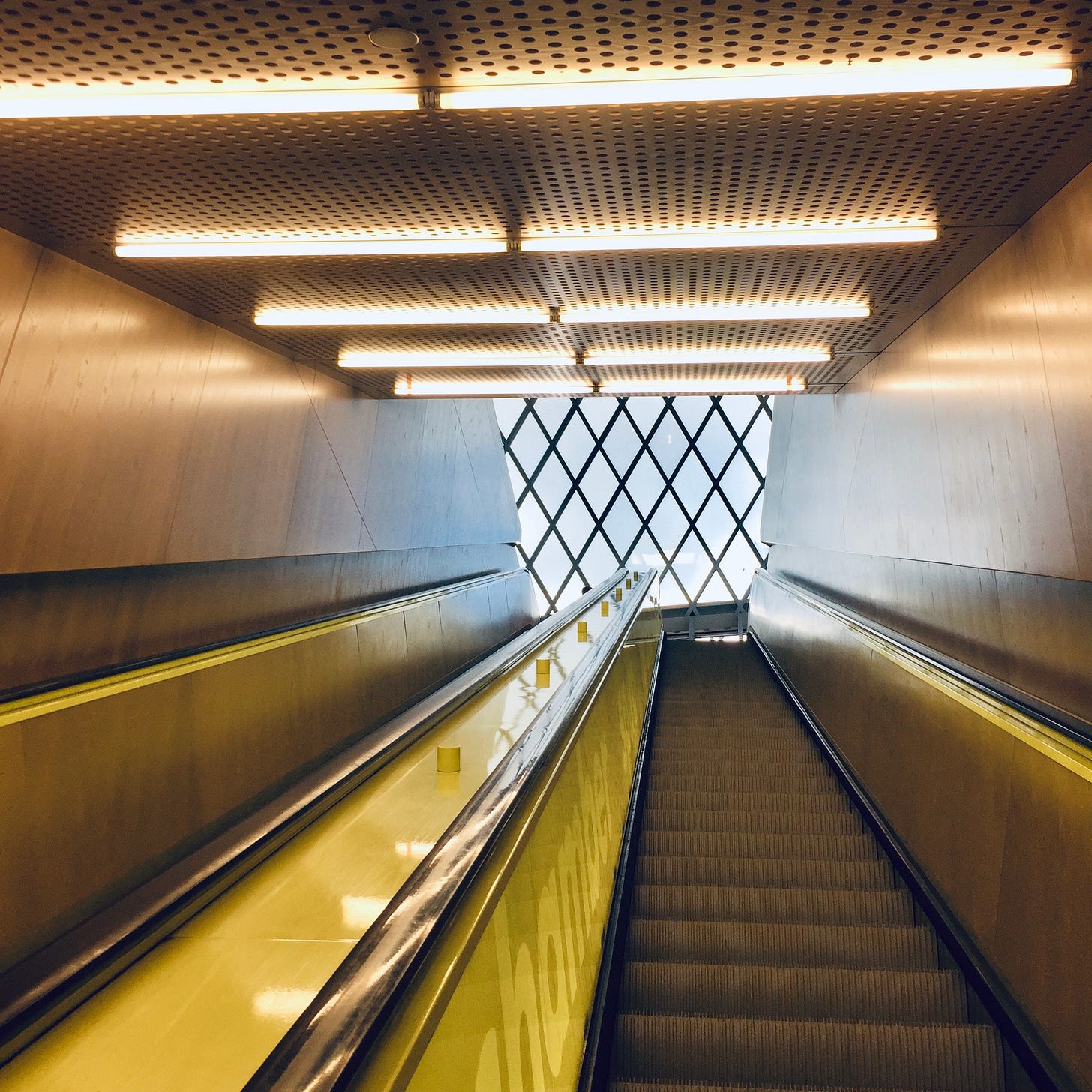 A brightly lit escalator