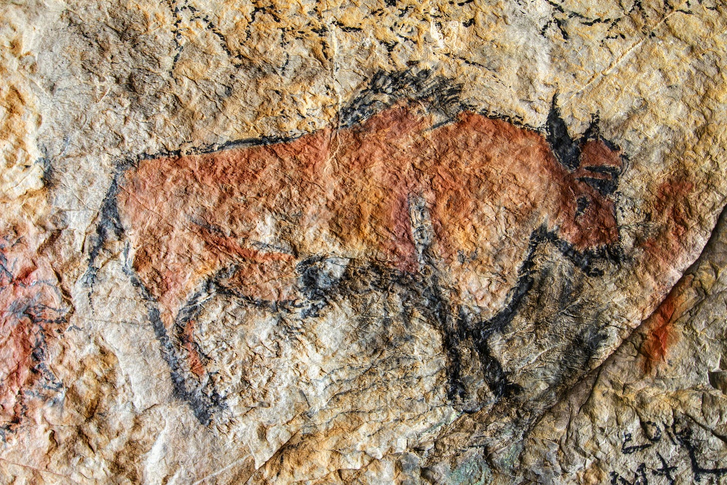 An ancient cave image of a bull, similar to that found in Indonesia.