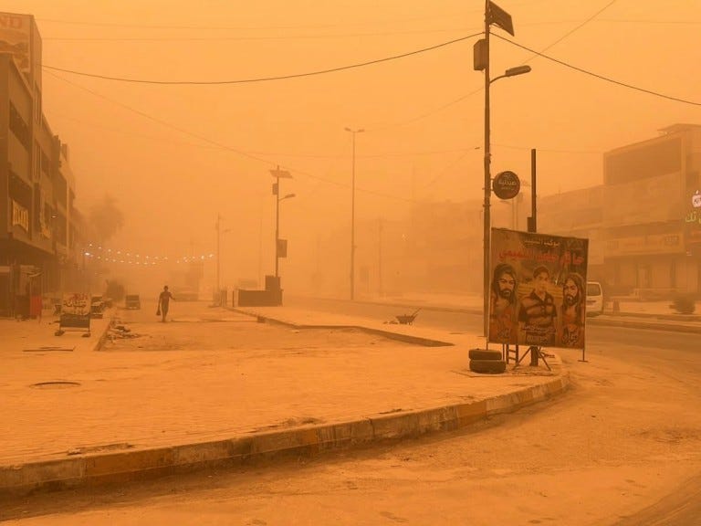 A man walks through a sand storm in Baghdad, Iraq, Thursday, May 5, 2022. Hundreds of Iraqis with respiratory problems went to hospitals with flights suspended on Thursday as Iraqis awoke to a fifth sand storm to engulf the country within a month. (AP Photo/Ali Abdul Hassan)