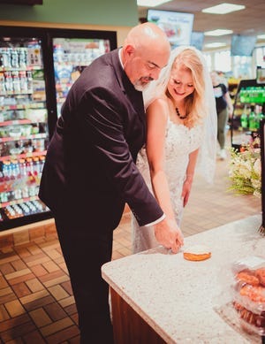 A few weeks after their summer wedding, Mark Steinke and Ashley Ormes had a wedding photo shoot at a Janesville Kwik Trip.