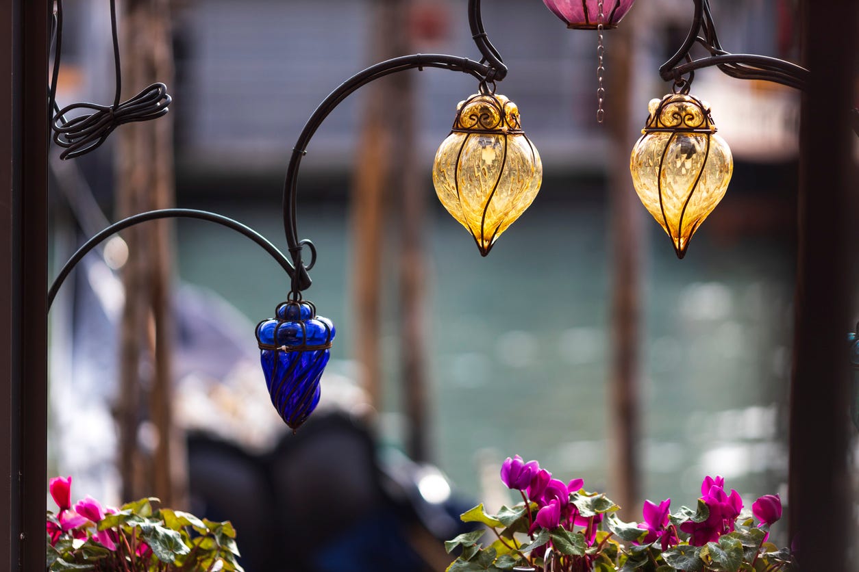 Glass protects the lights inside lanterns from the wind. These are old Venetian glass lanterns.