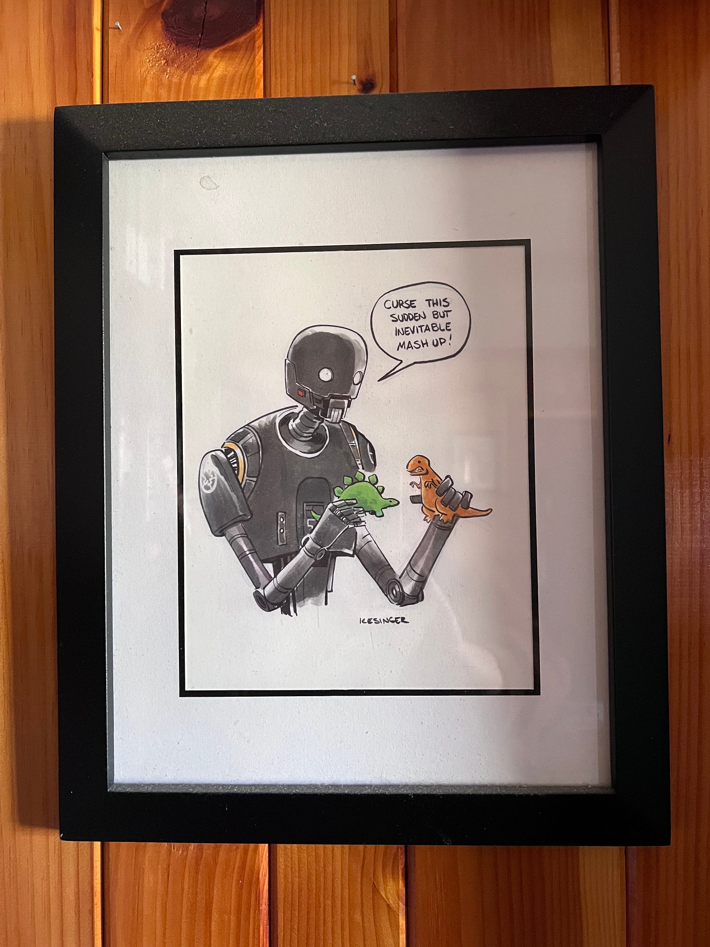 Photo of an illustration of K2SO playing with dinosaur toys