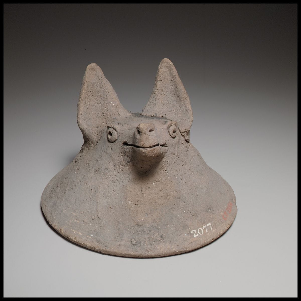 Terracotta mask in the shape of the head of a fox, dog, or bat, Terracotta, Cypriot 