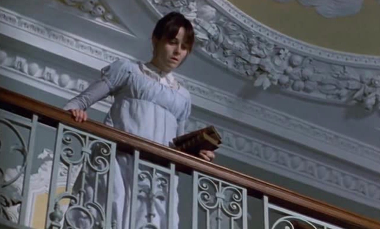 The actress Amanda Root portrays 'Persuasion's' Anne Elliot. She wears a white Regency gown and is holding books as she peers over a grand balcony. The actress Amanda Root portrays 'Persuasion's' Anne Elliot. She wears a white Regency gown and is holding books as she peers over a grand balcony.