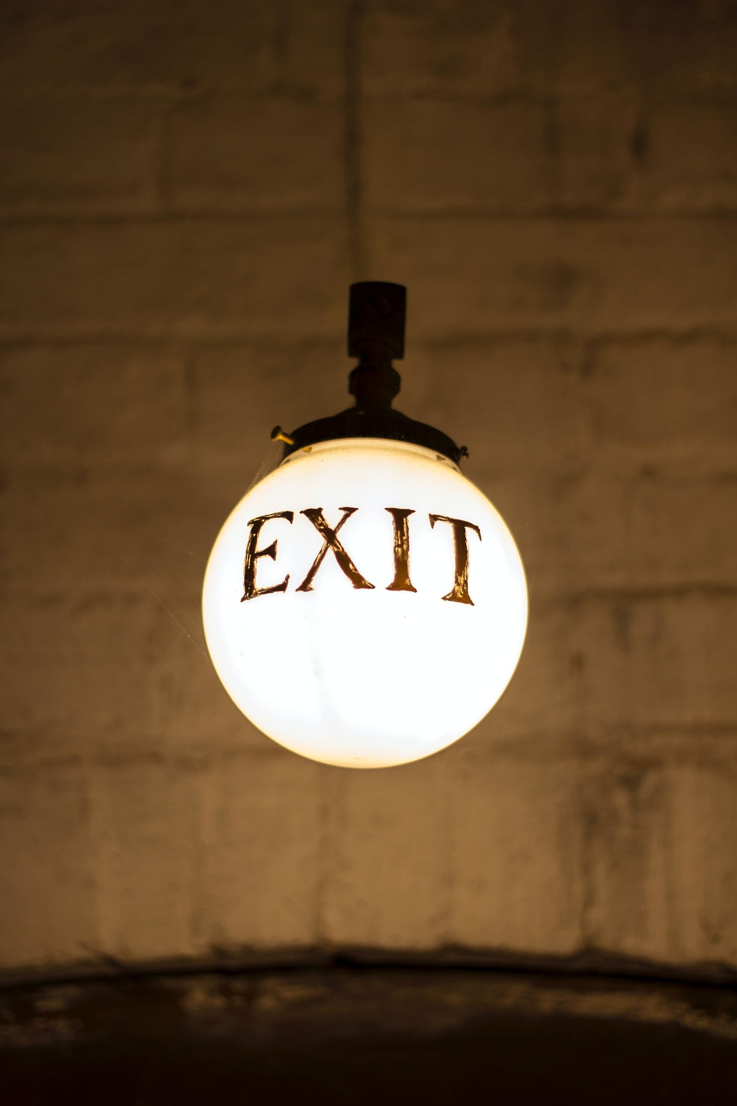 Image of hanging globe light with the word EXIT.