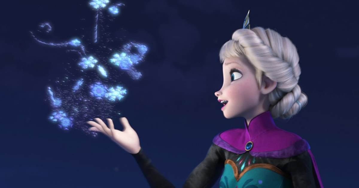 Still from Frozen of Elsa creating snowflakes and looking at the flurry in her hand