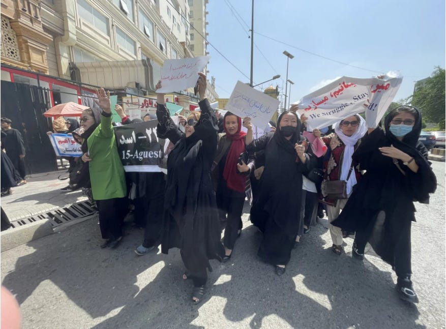 Women march in a rare protest in Kabul's streets — and face violence from the Taliban
