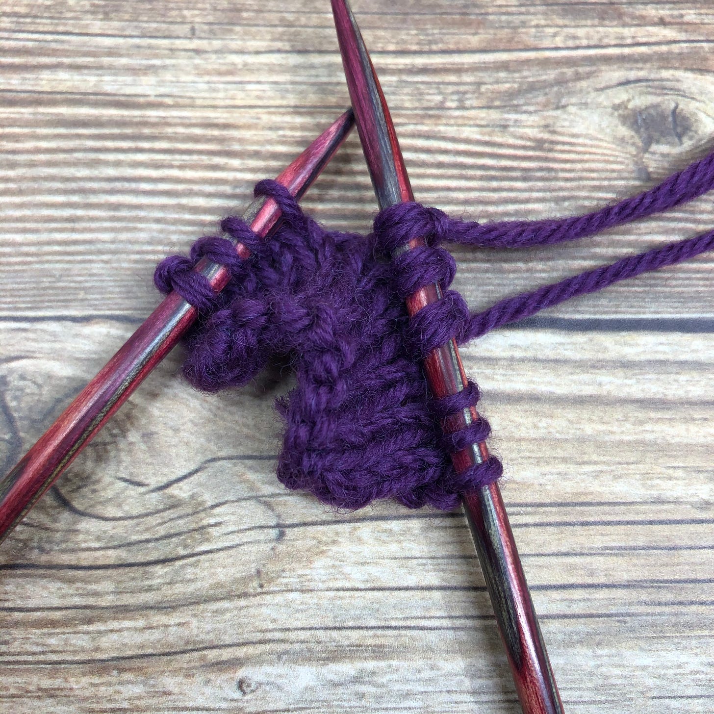 Three stitches with two strands of yarn