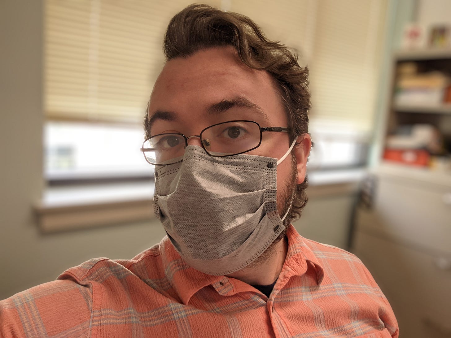 Selfie of the author in his office, masked.