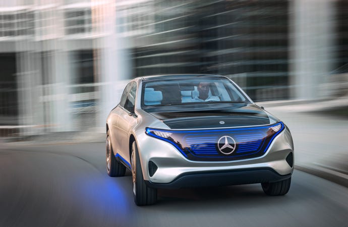 The Mercedes-Benz Electric Intelligence concept car, pictured from the front as it drives.