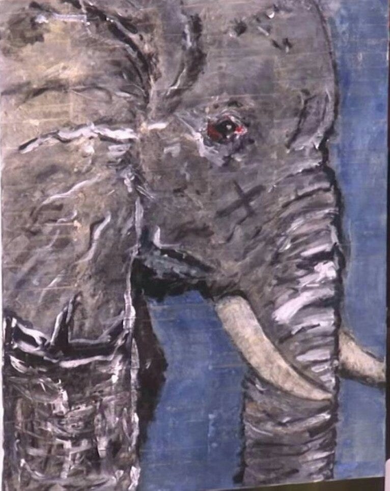 A rudimentary painting of an elephant's head, trunk, tusks, and ears in profile. It looks like it was made by a child.