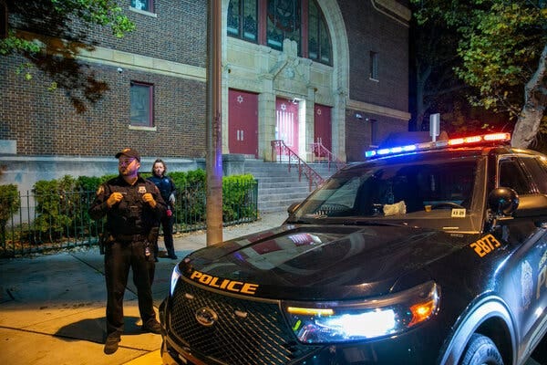 Police stand outside Temple Beth-El synagogue in Jersey City, N.J., on Thursday. The FBI said it had received credible information about a “broad” threat to synagogues in the state.
