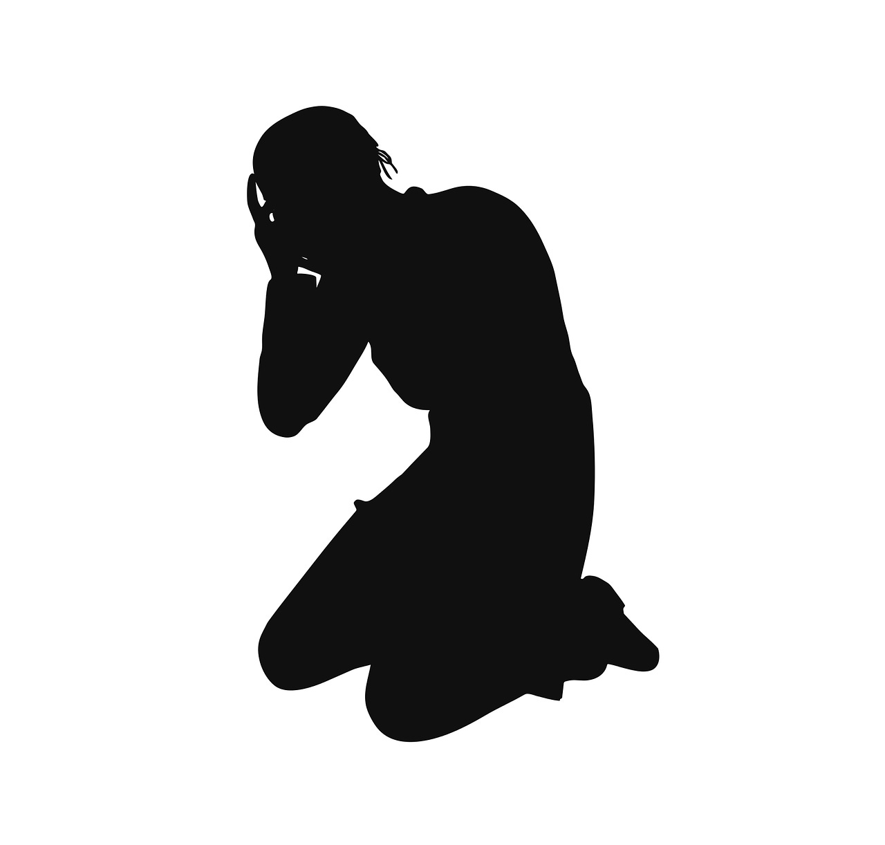 Silhouette of a person on their knees with their head in their hands.