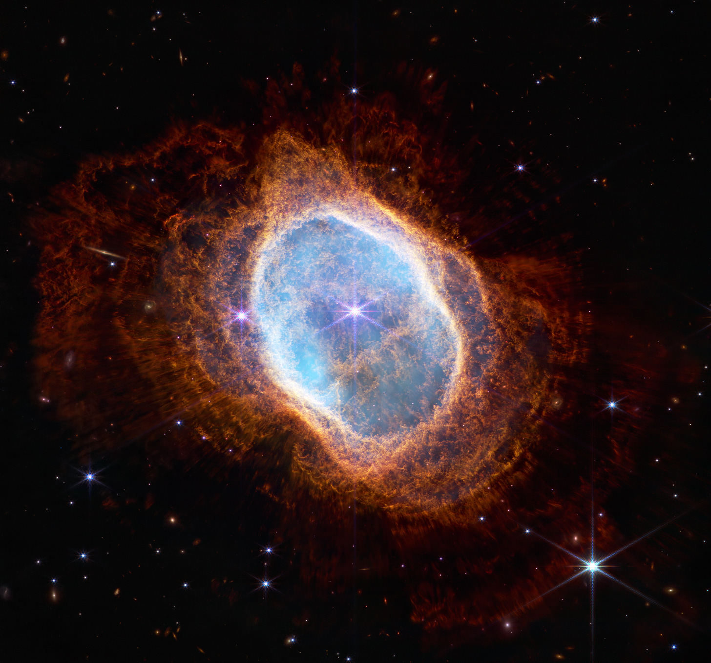  The Southern Ring Nebula, which is sometimes called “eight-burst.’ About 2,500 light-years away, it shows an expanding cloud of gas surrounding a dying star.