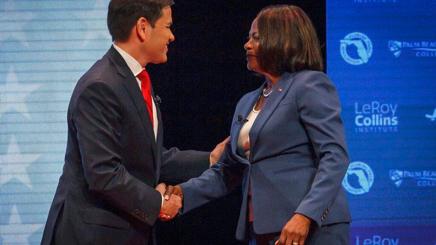 U.S. Sen. Marco Rubio, R-Fla., and his challenger, U.S. Rep. Val Demings, D-Fla., greet each other before a televised debate at Duncan Theater on the campus of Palm Beach State College in Palm Beach County on Tuesday.