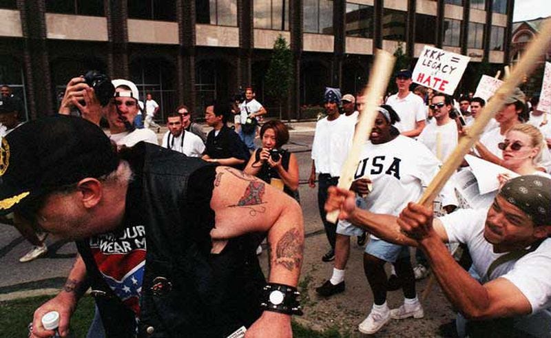 When the crowd noticed a white man with a Confederate flag T-shirt and an SS tattoo among them, they chased him down the street.