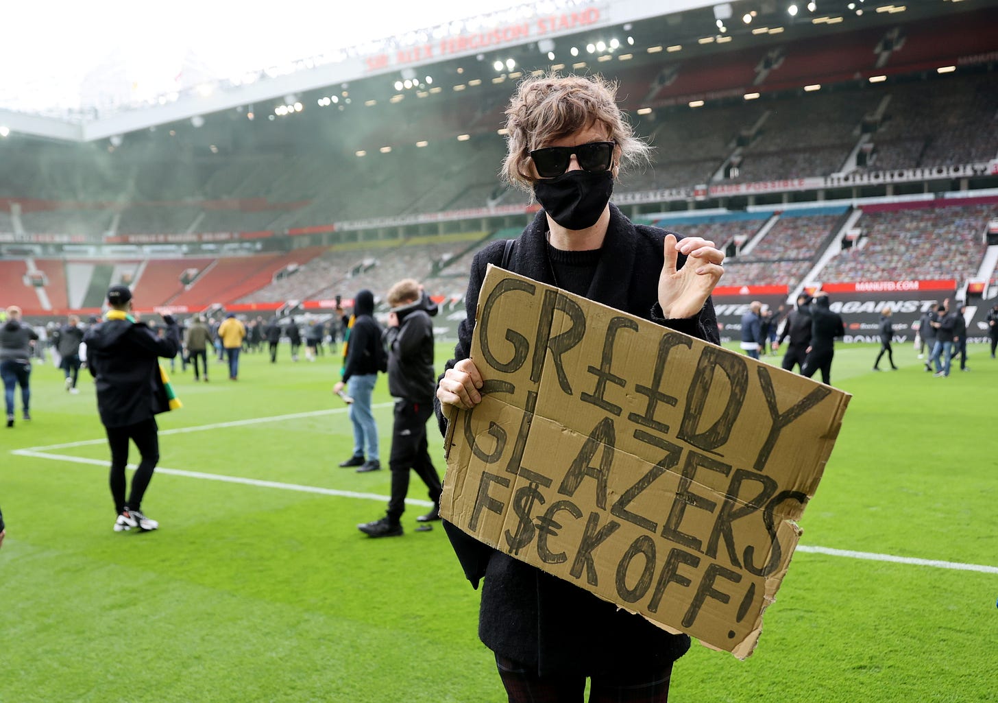Protesting Man United fans break into Old Trafford and invade pitch ahead  of Liverpool match | Reuters