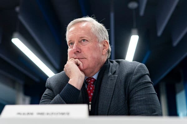 Mark Meadows resting his chin on his hand.