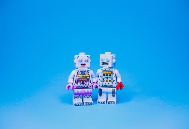 Purple and white toy robot photo