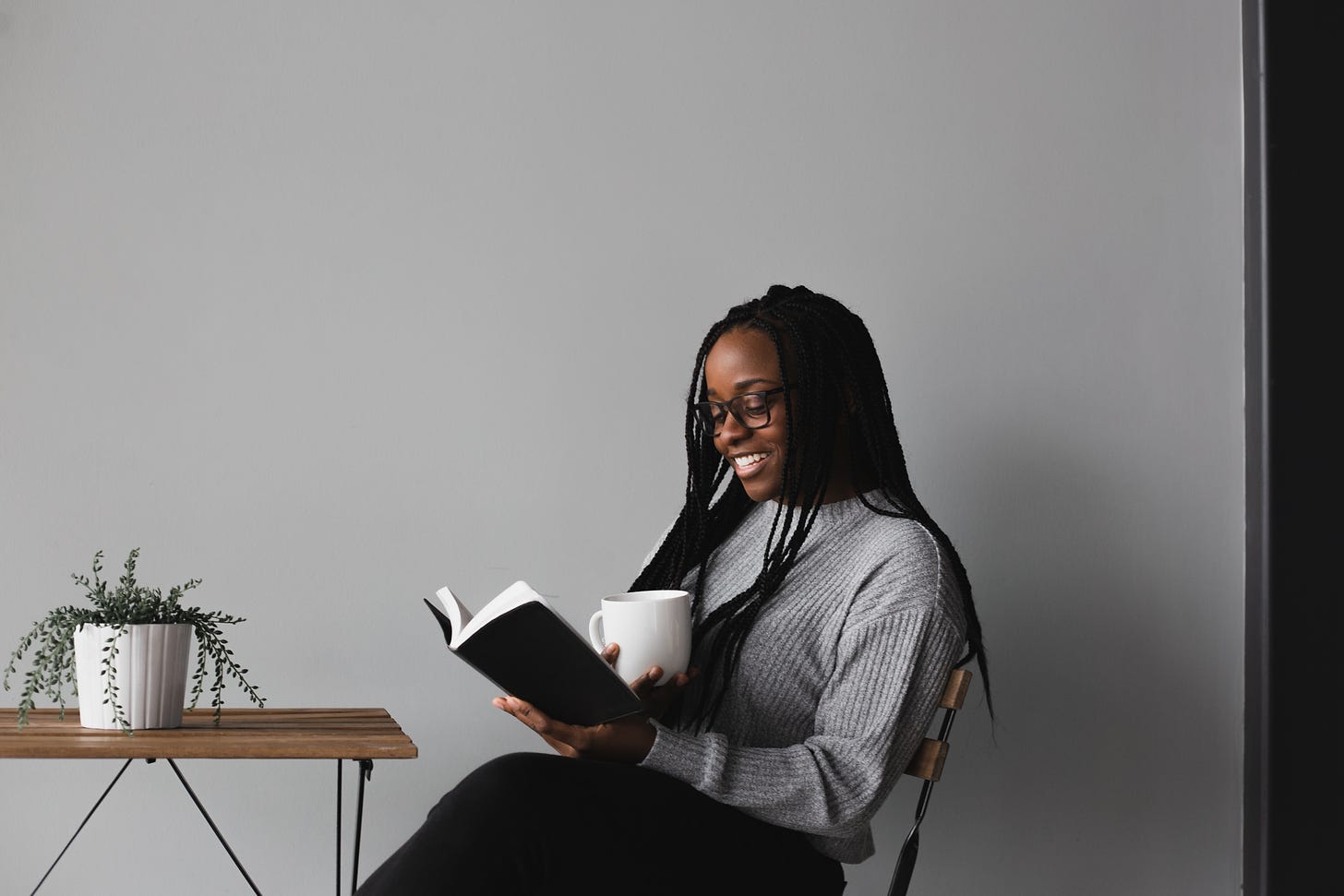 Black woman reading photo by Alexandra Fuller