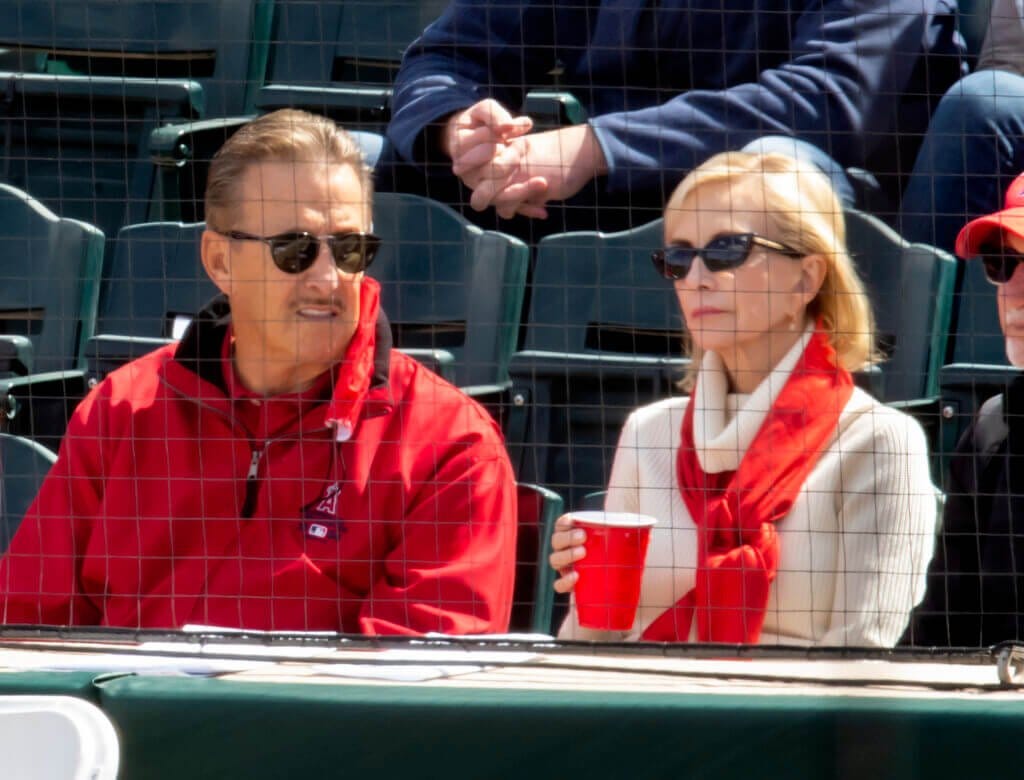 Mar 16, 2021; Tempe, Arizona, USA; Los Angeles Angels owner Arte Moreno (left) with wife Carole Moreno against the Cleveland Indians during a Spring Training game at Tempe Diablo Stadium. Mandatory Credit: Mark J. Rebilas-USA TODAY Sports