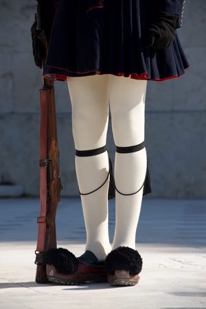 Greek guardsman with rifle from waist down.jpg