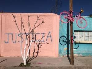 Graffiti and a pink bicycle at the scene of Isabel’s murder, Calle Ochoa, Ciudad Juárez. Photograph - Ed Vulliamy