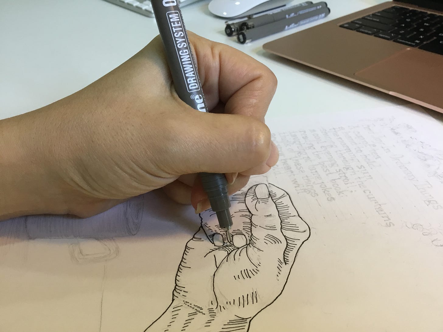 image: photo of me using a fine liner pen, drawing a close up of a hand in line drawing style