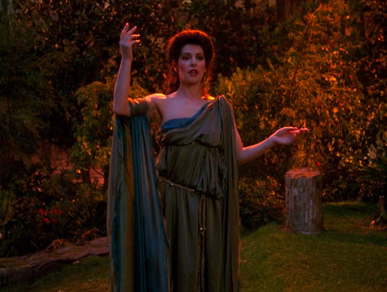 This image shows Counselor Deanna Troi (played by Marina Sirtis) as the Grecian-inspired and -dressed Goddess of Empathy in Reginald Barclay's holodeck fantasy as depicted in Star Trek: The Next Generation's Season 3 episode "Hollow Pursuits." This image shows Counselor Deanna Troi (played by Marina Sirtis) as the Grecian-inspired and -dressed Goddess of Empathy in Reginald Barclay's holodeck fantasy as depicted in Star Trek: The Next Generation's Season 3 episode "Hollow Pursuits."