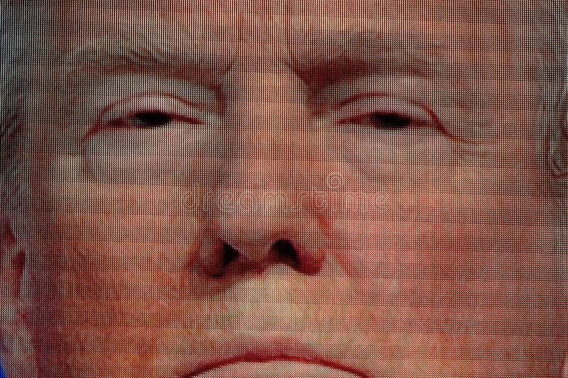 Eyes of Donald Trump peering down from the big screen 