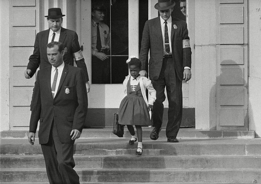 Ruby Bridges leaving school with federal agents