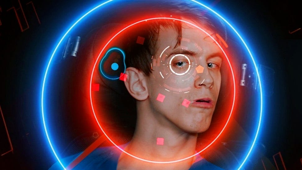 HyperDot game in foreground with player in background, his eye and the player dot circled to indicate tracking
