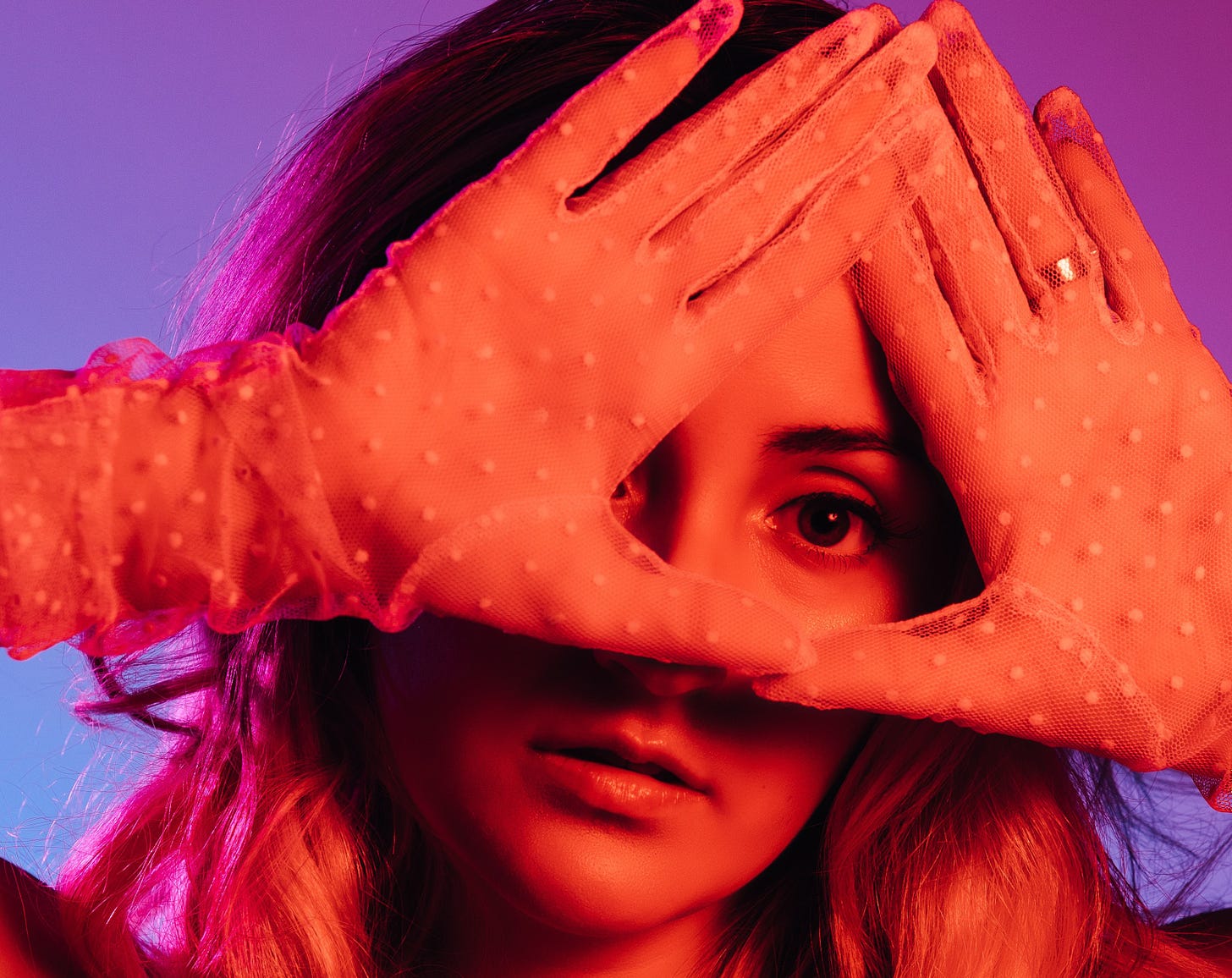 Photo of a girl making the illuminati sign, by photographer Kyle Cleveland