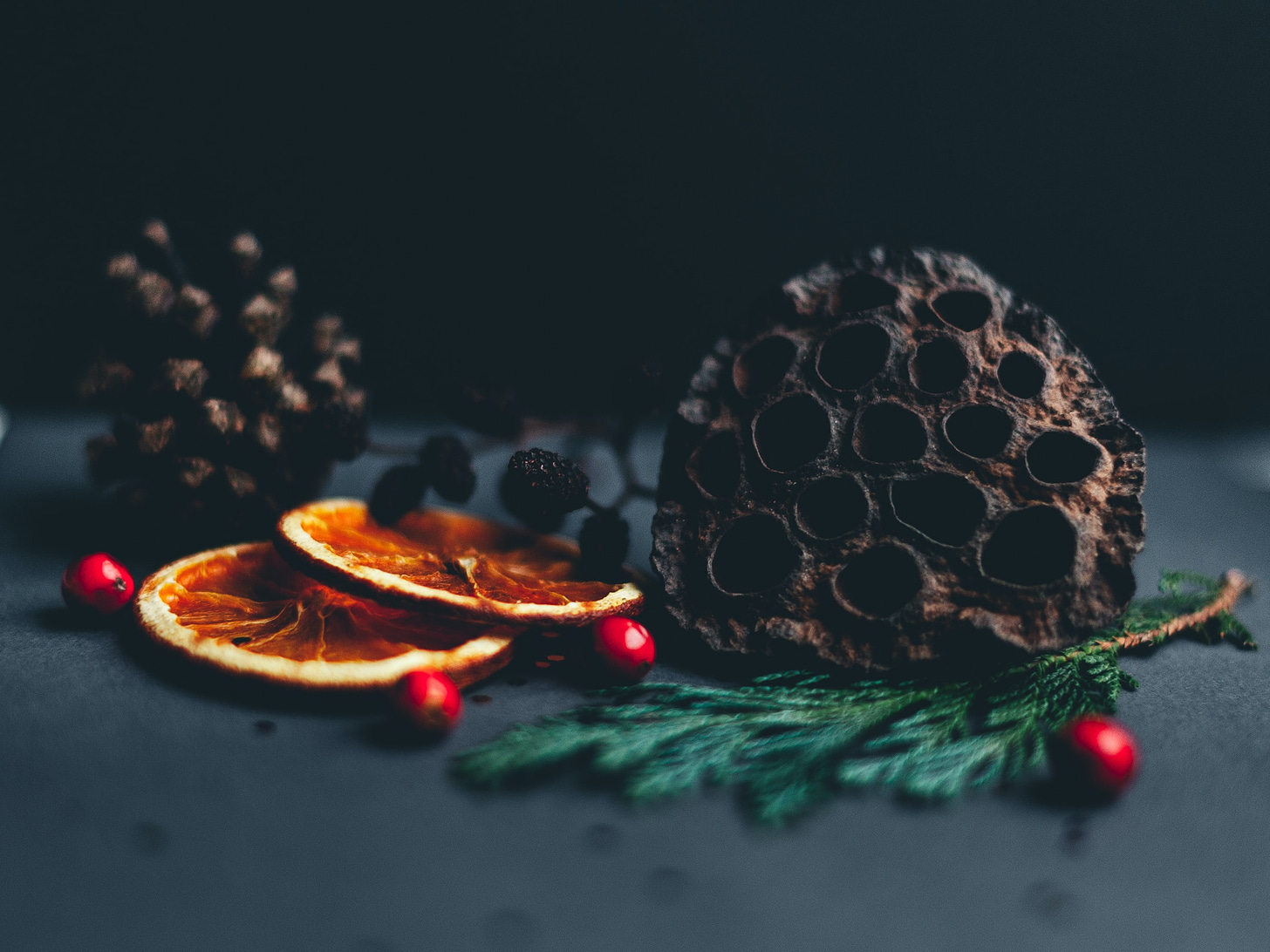 Pine cones, dried oranges, and berries