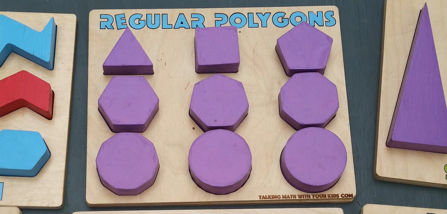 A shape sorting board for "regular polygons".