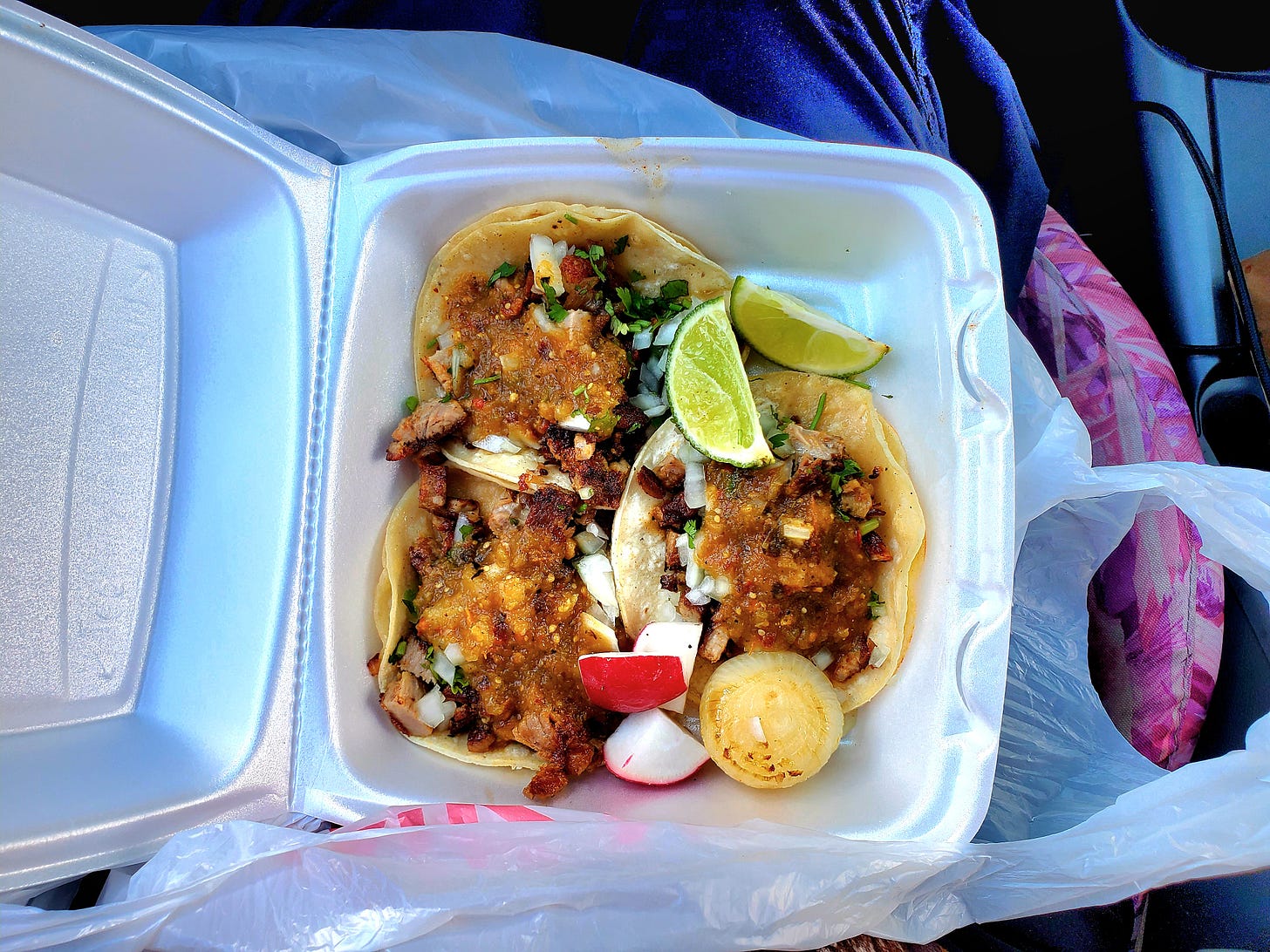 Three carnitas street tacos