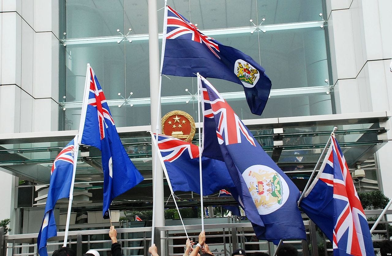 File:Protesters waving the Hong Kong colonial flag in front of ...