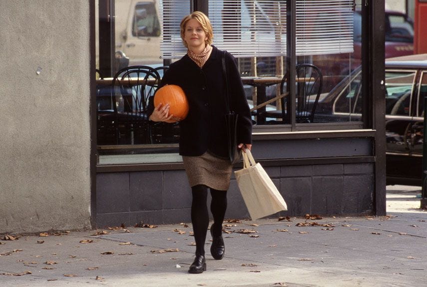 Meg Ryan carrying a pumpkin