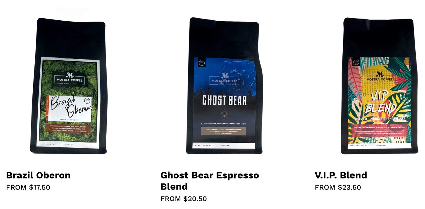 An image of various black Mostra Coffee bags with their prices linked to the kayak.coffee shopping cart online.