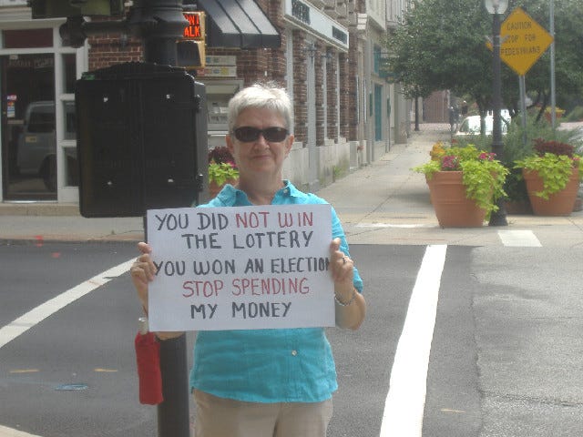 I didn't like the idea of one-sided 'I am AFP' signs but this woman took advantage to write her own message. We'll see if Frank Kratovil is rich like a lottery winner after his time in Congress is over.