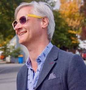 Picture of Rory O'Connor smiling and wearing yellow sunglasses
