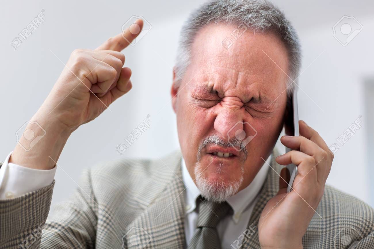 Portrait Of An Angry Businessman Yelling At Phone Stock Photo, Picture And  Royalty Free Image. Image 86523892.
