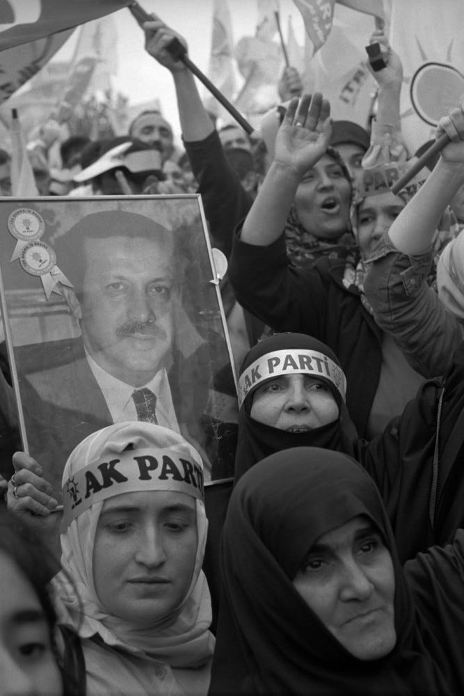Abbas | Militants of the islamist AKP (Justice and Development Party) display a portrait of their leader Recep Tayyip Erdogan at a rally, before the parliamentary elections of November 3rd 2002. Istanbul, (...) - Magnum Photos 