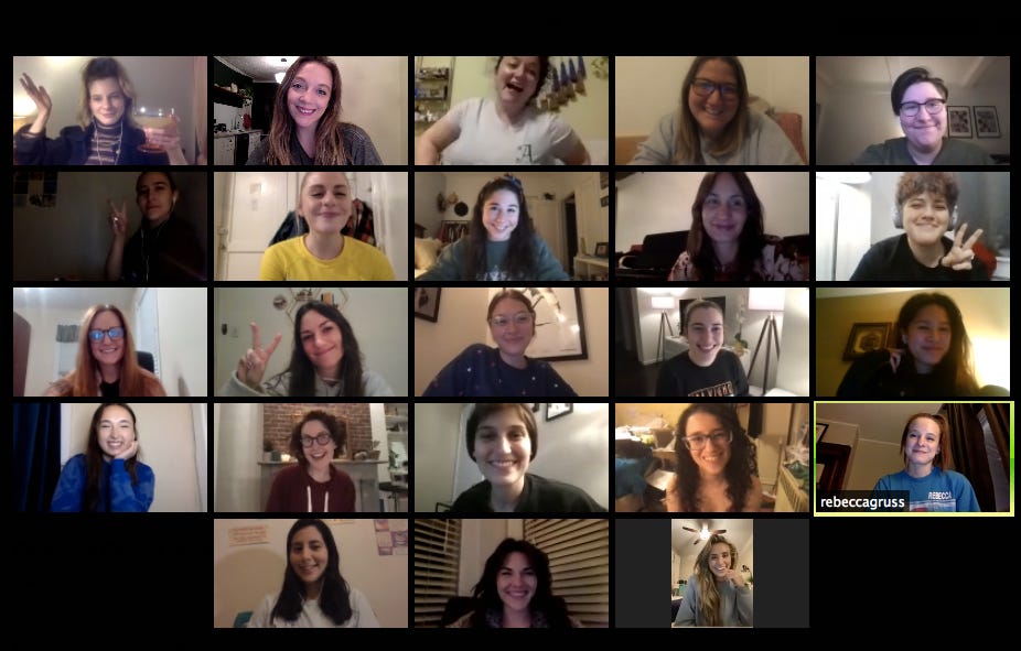 Zoom screenshot of 23 individual people smiling at their cameras.
