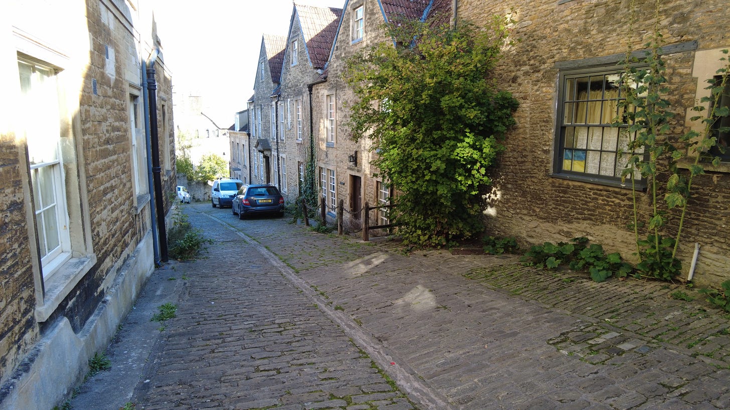 This is Gentle Street, Frome. Some scenes from the TV series Poldark were filmed here. This is a very old street in this Somerset town.