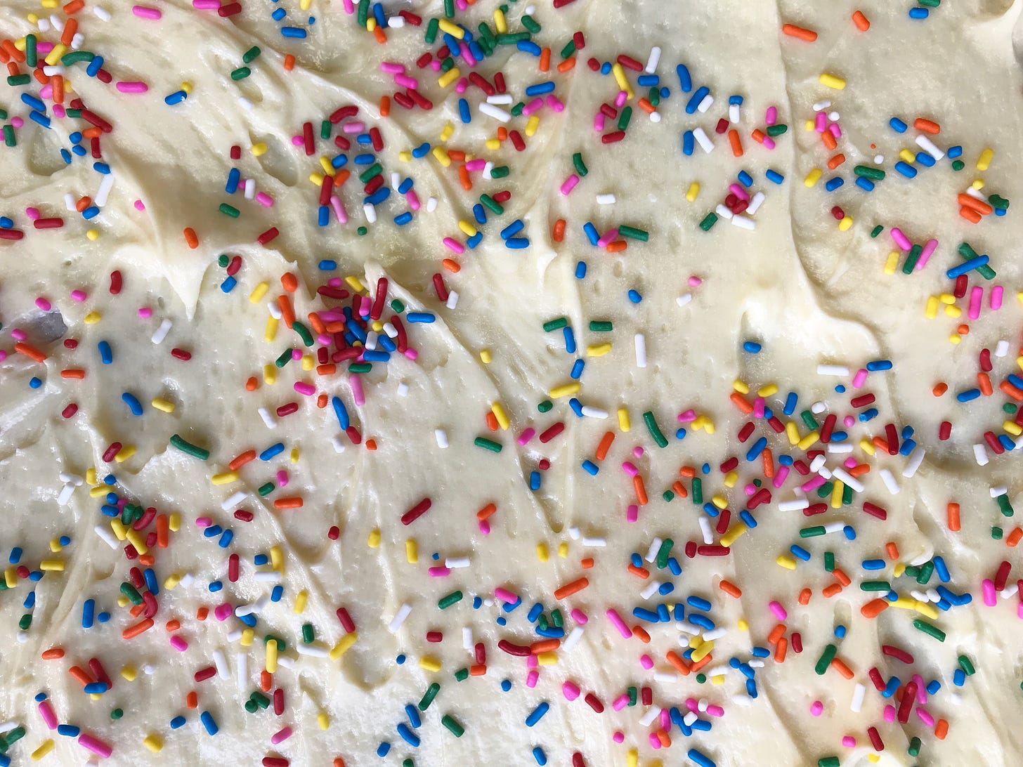 Sheet cake with rainbow colored sprinkles