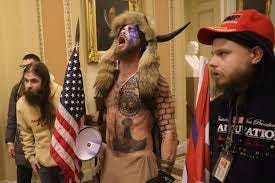 Fact check: Face-painted man in horned fur cap at Capitol riot supports  Trump and QAnon, not antifa