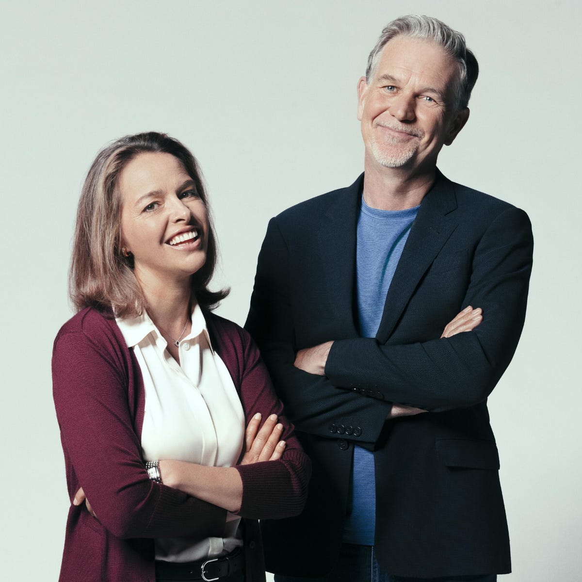 Erin Meyer and Reed Hastings, both in portrait, smiling to camera.