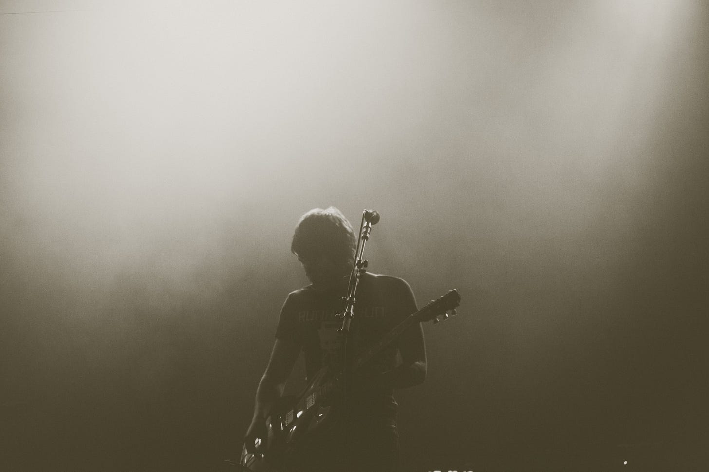 image of a musician on stage with dry ice around for article by Larry G. Maguire